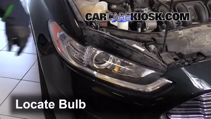 2014 Ford Fusion SE 2.5L 4 Cyl. Lights Headlight (replace bulb)