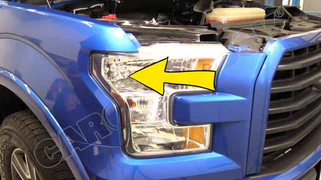 The headlight is in the front bulb housing, in the upper left section of the housing